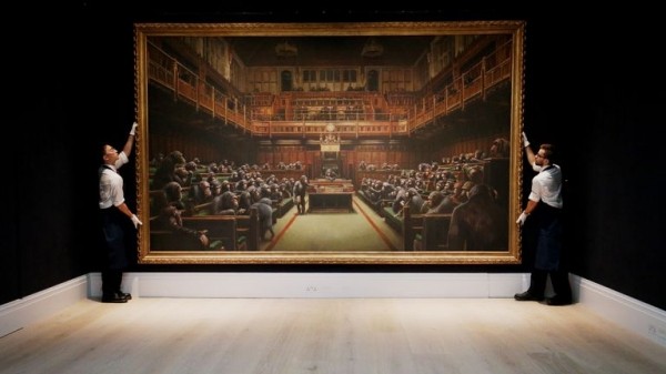 Banksy piece Devolved Parliament sells for record £9.8m at auction
Banksy piece Devolved Parliament sells for record £9.8m at auction