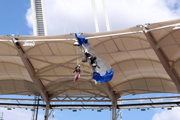 
      Rugby game delayed after parachutist dangles from the stadium roof prior to kickoff
    