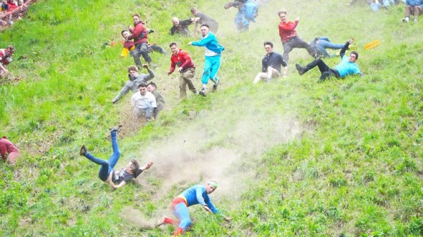 Cheese-loving daredevils hurl themselves down Cooper's Hill in Gloucestershire for famous race Cheese-loving daredevils hurl themselves down Cooper's Hill in Gloucestershire for famous race
