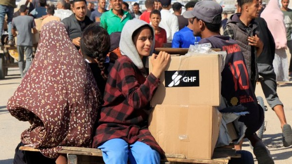 Palestinians flock to Gaza aid centres despite concerns - as lawyers call for sanctions on Israel Palestinians flock to Gaza aid centres despite concerns - as lawyers call for sanctions on Israel
