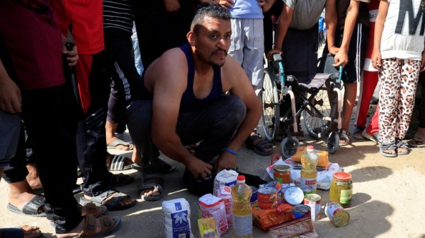 Palestinians flock to Gaza aid centres despite concerns - as lawyers call for sanctions on Israel Palestinians flock to Gaza aid centres despite concerns - as lawyers call for sanctions on Israel