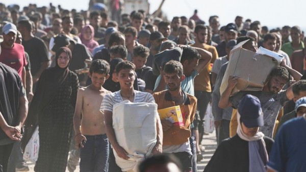 Palestinians flock to Gaza aid centres despite concerns - as lawyers call for sanctions on Israel Palestinians flock to Gaza aid centres despite concerns - as lawyers call for sanctions on Israel