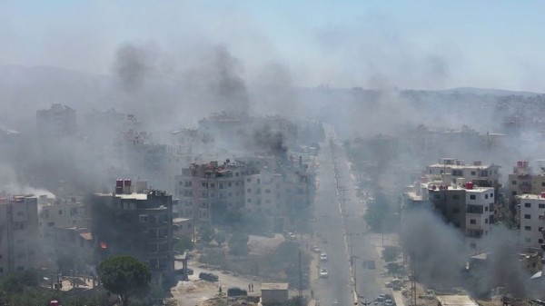 Homes still burning after mass pillaging and 30,000 trapped in besieged city - as Syria's fragile ceasefire holds Homes still burning after mass pillaging and 30,000 trapped in besieged city - as Syria's fragile ceasefire holds