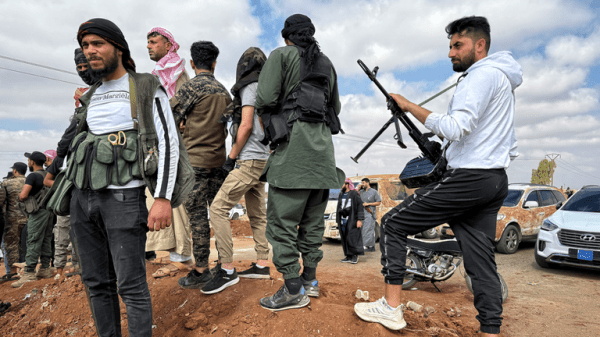 Homes still burning after mass pillaging and 30,000 trapped in besieged city - as Syria's fragile ceasefire holds Homes still burning after mass pillaging and 30,000 trapped in besieged city - as Syria's fragile ceasefire holds