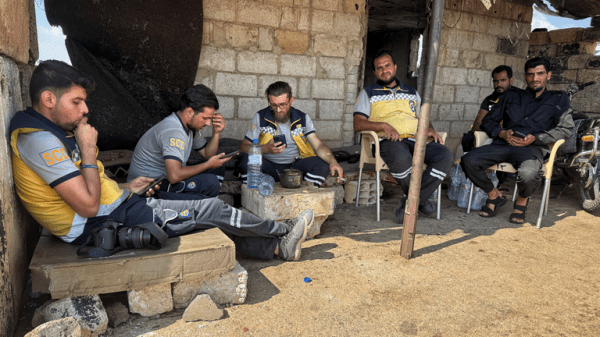 Homes still burning after mass pillaging and 30,000 trapped in besieged city - as Syria's fragile ceasefire holds Homes still burning after mass pillaging and 30,000 trapped in besieged city - as Syria's fragile ceasefire holds